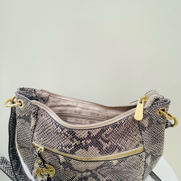 Hi everyone I’m selling my MK Boho Fringe shoulder bag gray snake skin. - Picture 2 of 2